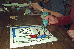 Putting the finishing touches on glass projects.