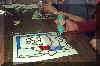 Finishing phase of glass painting project (grade 6).