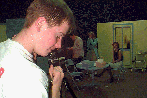 students videotaping drama