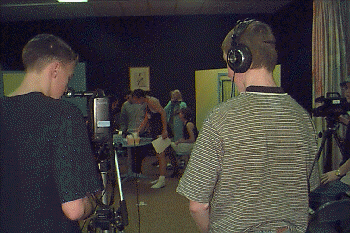 students videotaping drama